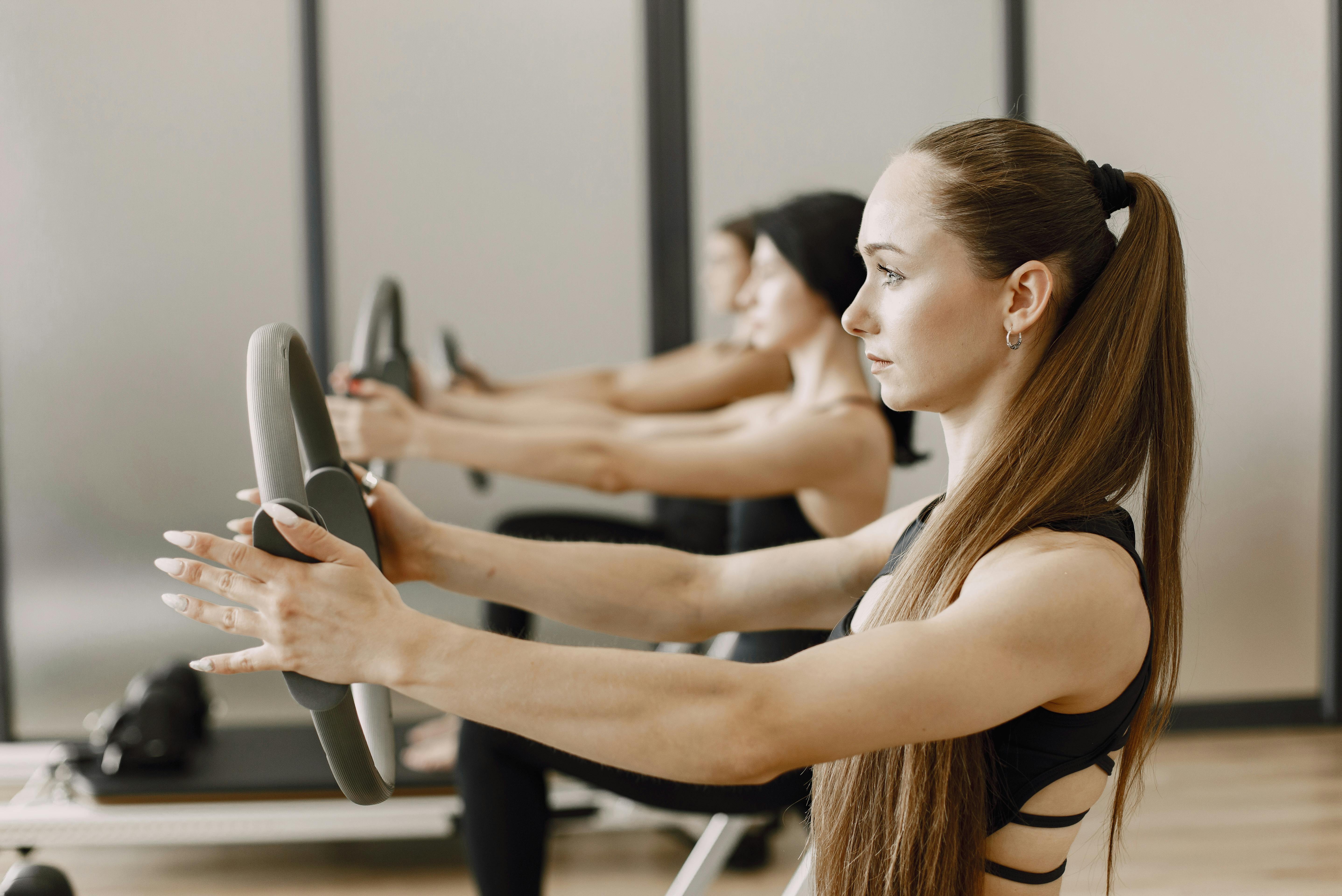 person using pilates ring